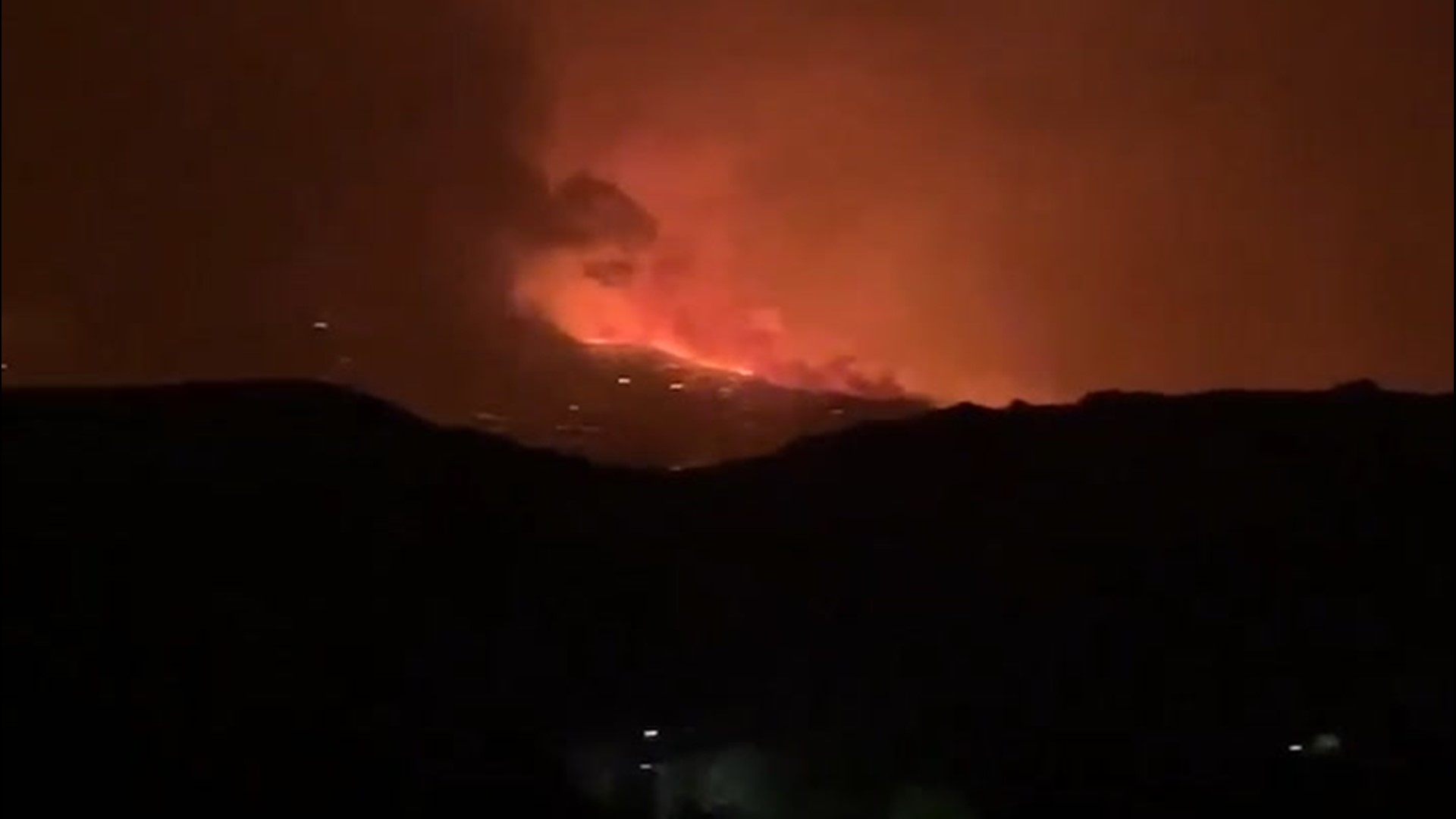The Slink Fire burns just west of Coleville, California, on the the Nevada border. An ominous glow looms over the mountains on the night of Sept. 2.