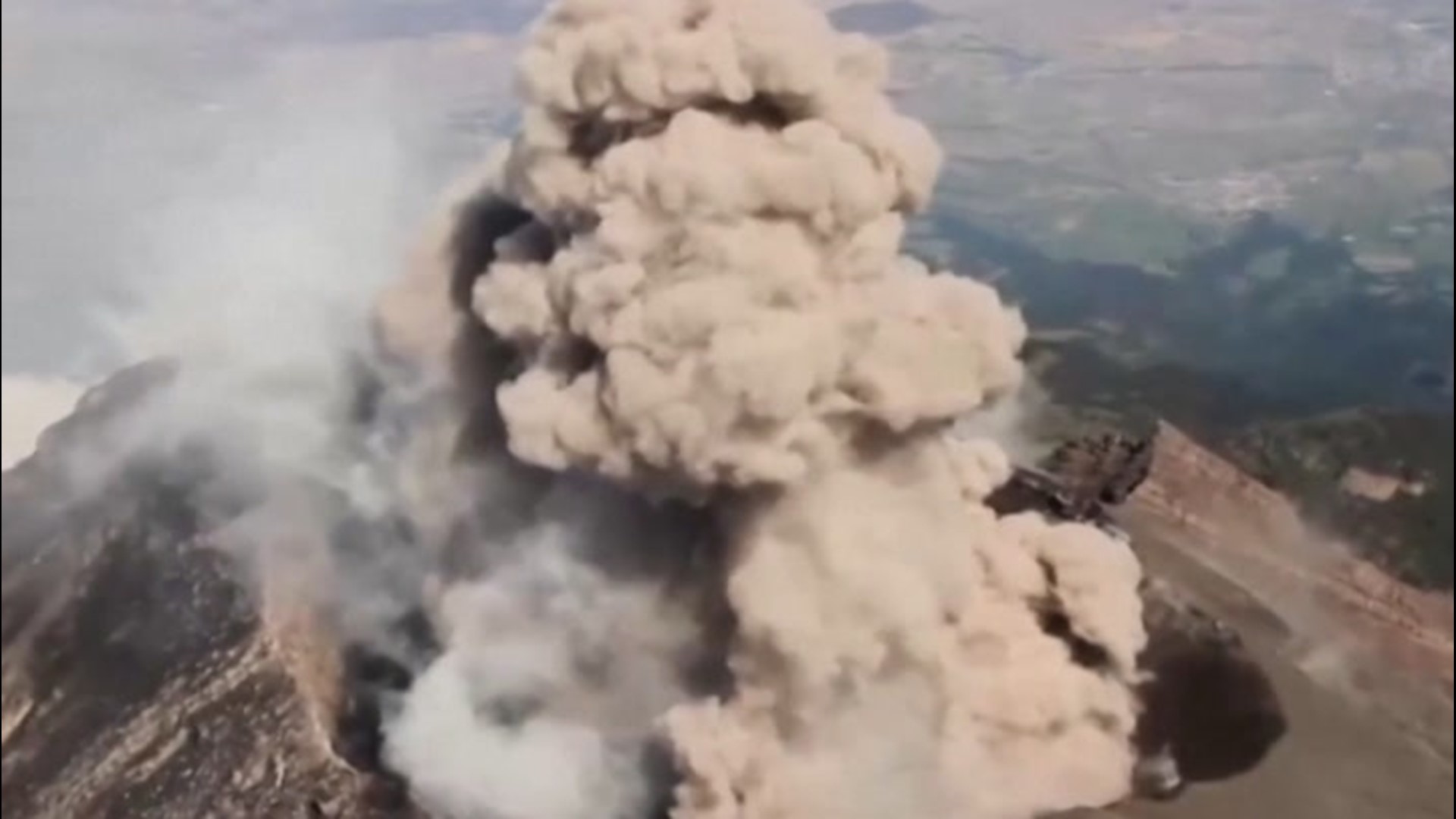 Aerial footage captures volcano  erupting from above  