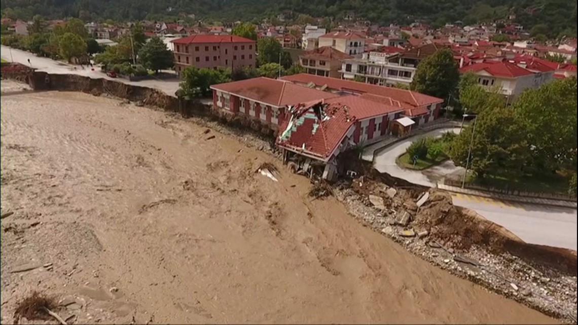Flooding causes building and road to collapse