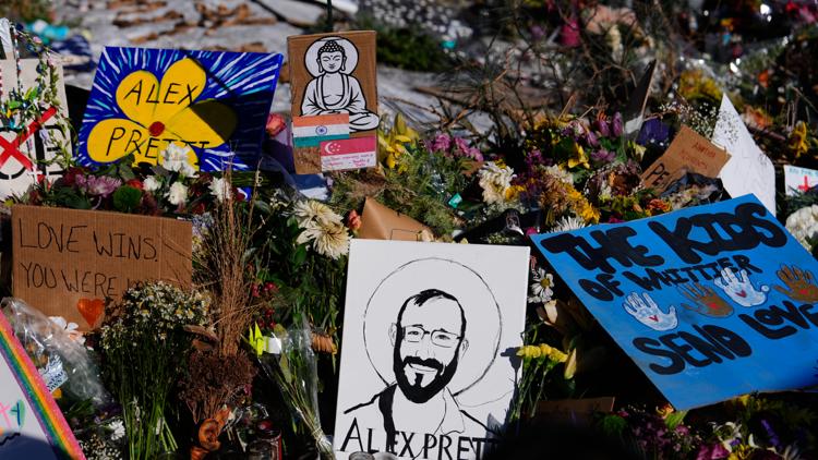 A drawing of Alex Pretti is displayed at the scene where Pretti was fatally shot by a Border Patrol officer, Jan. 27, 2026, in Minneapolis.