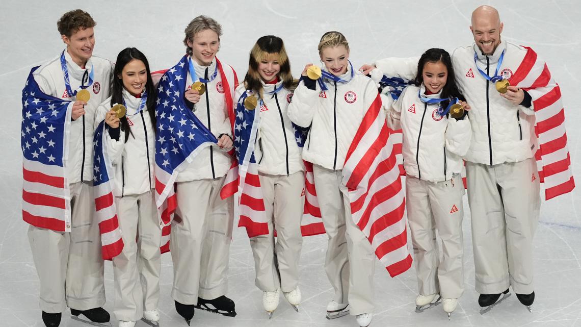 Team USA celebrate winning the gold medal after the figure skating team event at the 2026 Winter Olympics, in Milan, Italy, Sunday, Feb. 8, 2026.