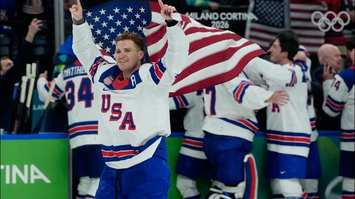Matthew Tkachuk (19) celebrates after the U.S. defeats Canada in a men's ice hockey gold medal game at the 2026 Olympics, in Italy, Feb. 22, 2026.