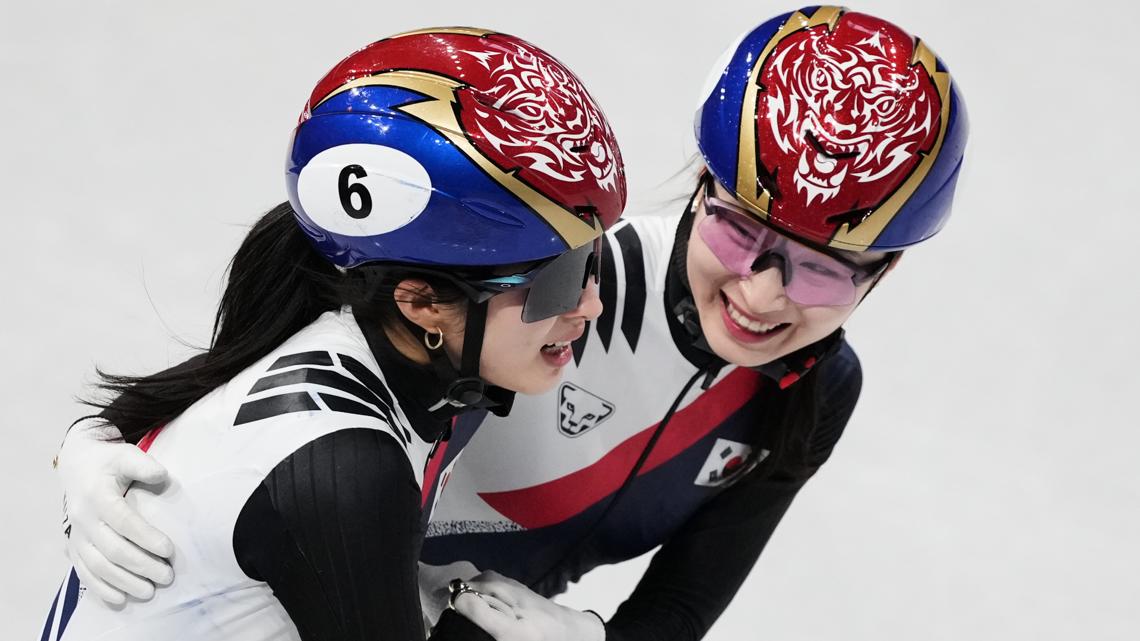 Kim Gilli and Choi Minjeong of Team Korea celebrate after winning gold in the short track women's team 3000m relay. (AP Photo/Francisco Seco)