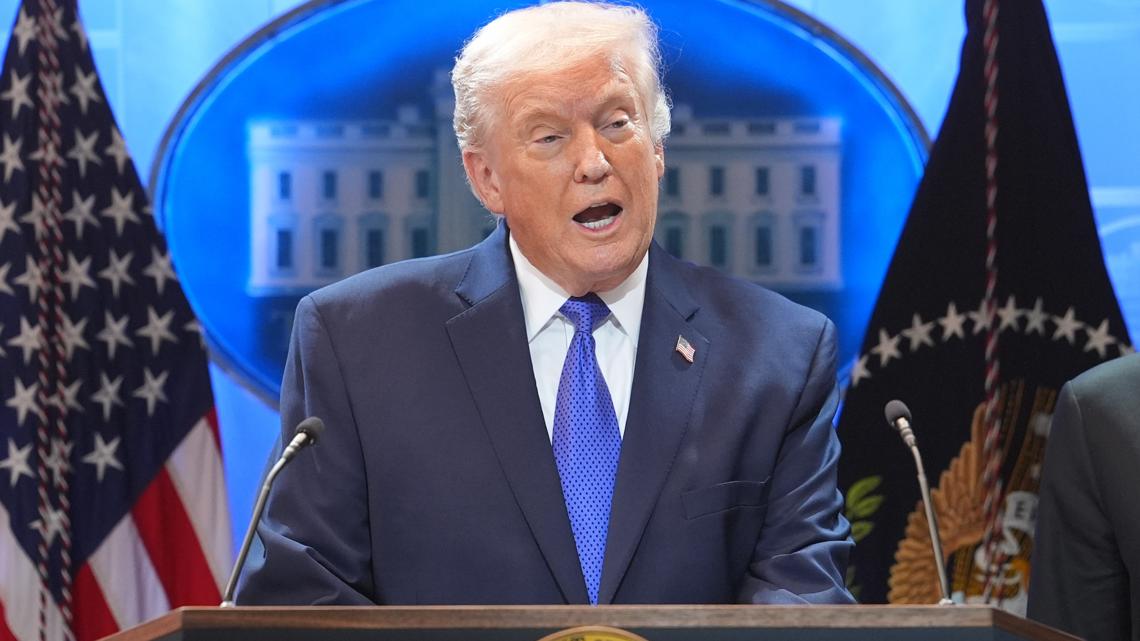 President Donald Trump speaks during a press briefing at the White House, in Washington. Beside the President is Commerce Secretary Howard Lutnik.