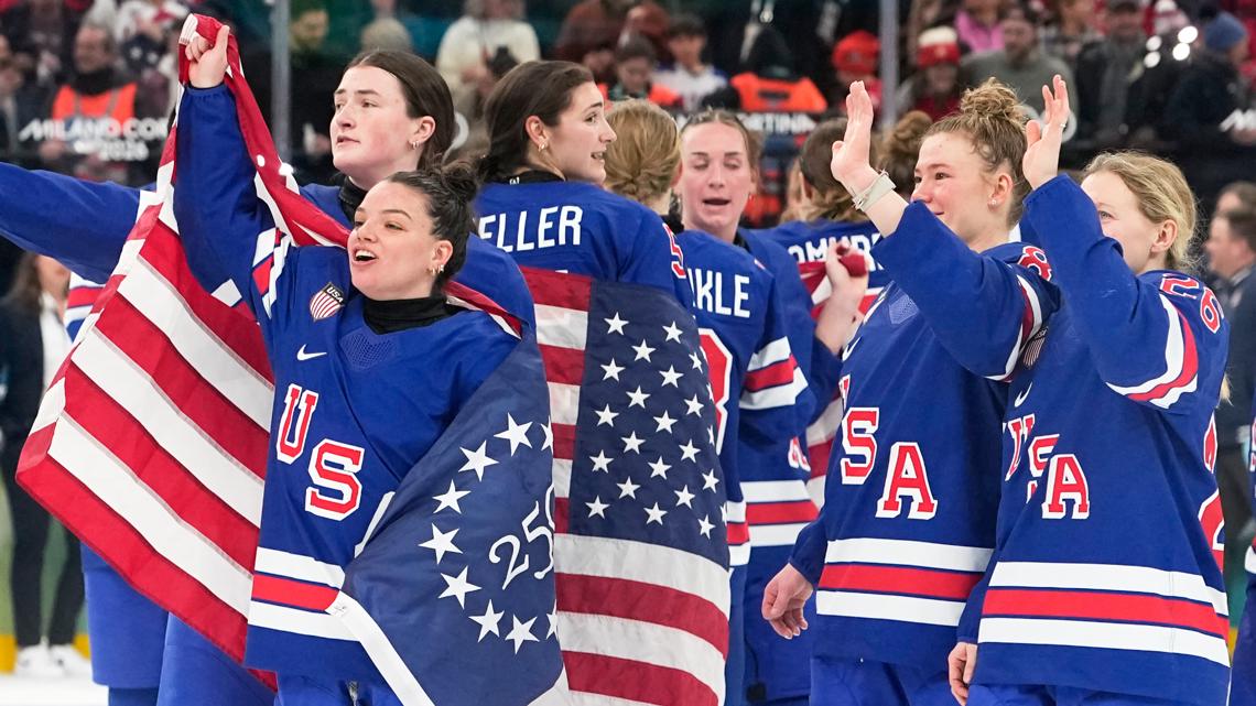 United States players celebrate after a women's ice hockey gold medal game between the U.S. and Canada at the 2026 Winter Olympics, in Milan, Feb. 19
