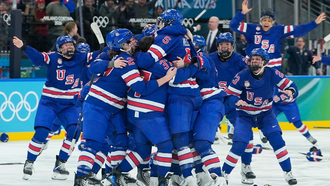 United States' players celebrate after a women's ice hockey gold medal game between the United States and Canada at the 2026 Winter Olympics, Feb. 19