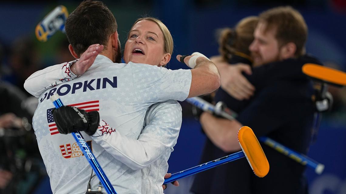 United States' Cory Thiesse hugs with Korey Dropkin at the end of the gold medal mixed doubles curling match