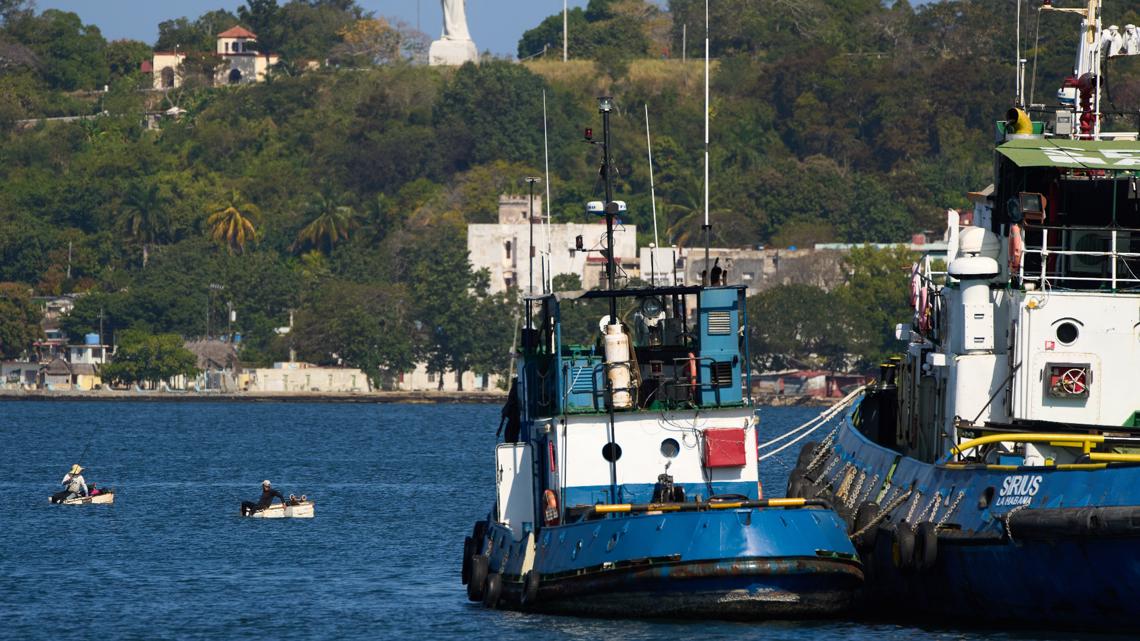 Two fisherman work from their makeshift "corcho" rafts in Regla, Cuba, Thursday, Feb. 26, 2026. (AP Photo/Ramon Espinosa)