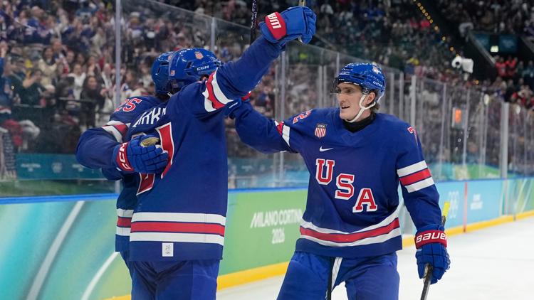 Tage Thompson, right, celebrates with Dylan Larkin after Larkin scored in the quarterfinal game at the 2026 Olympics. (AP Photo/Hassan Ammar)