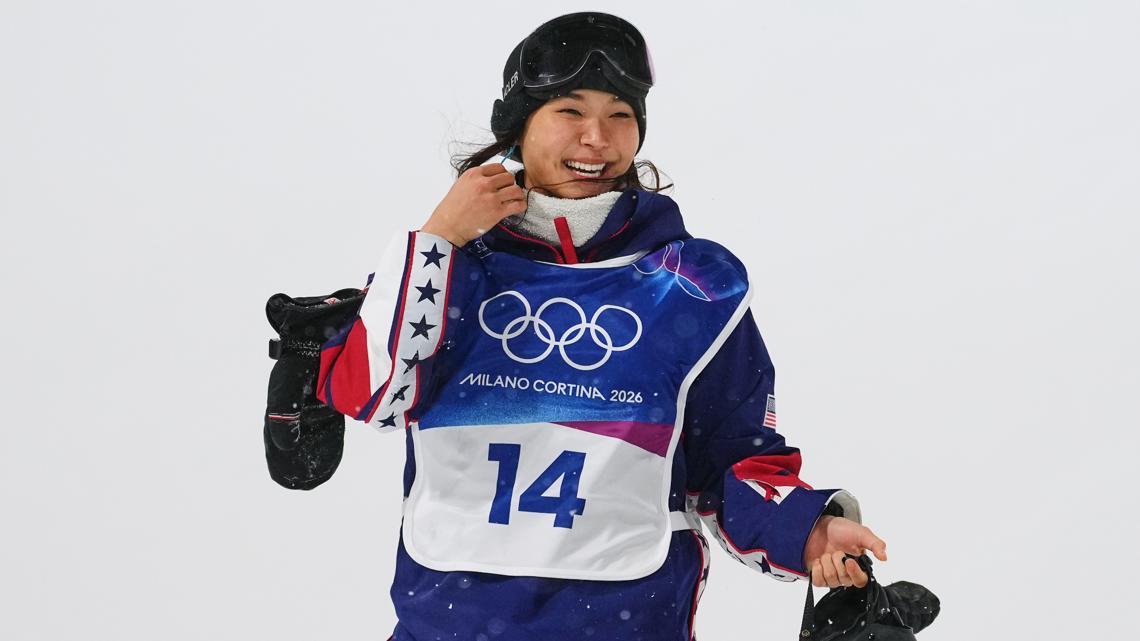 Chloe Kim smiles after crashing during the women's snowboarding halfpipe finals at the 2026 Winter Olympics, in Livigno, Italy, Feb. 12, 2026.
