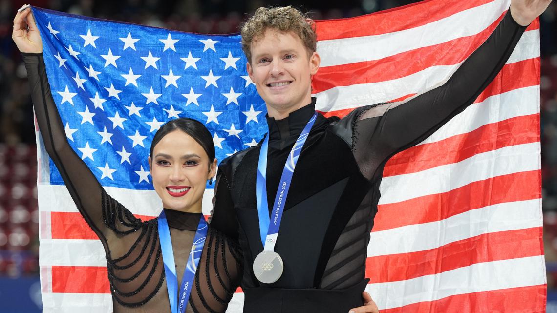 Silver medalists Madison Chock and Evan Bates of the United States pose with their medals after the ice dancing free skate at the 2026 Olympics.