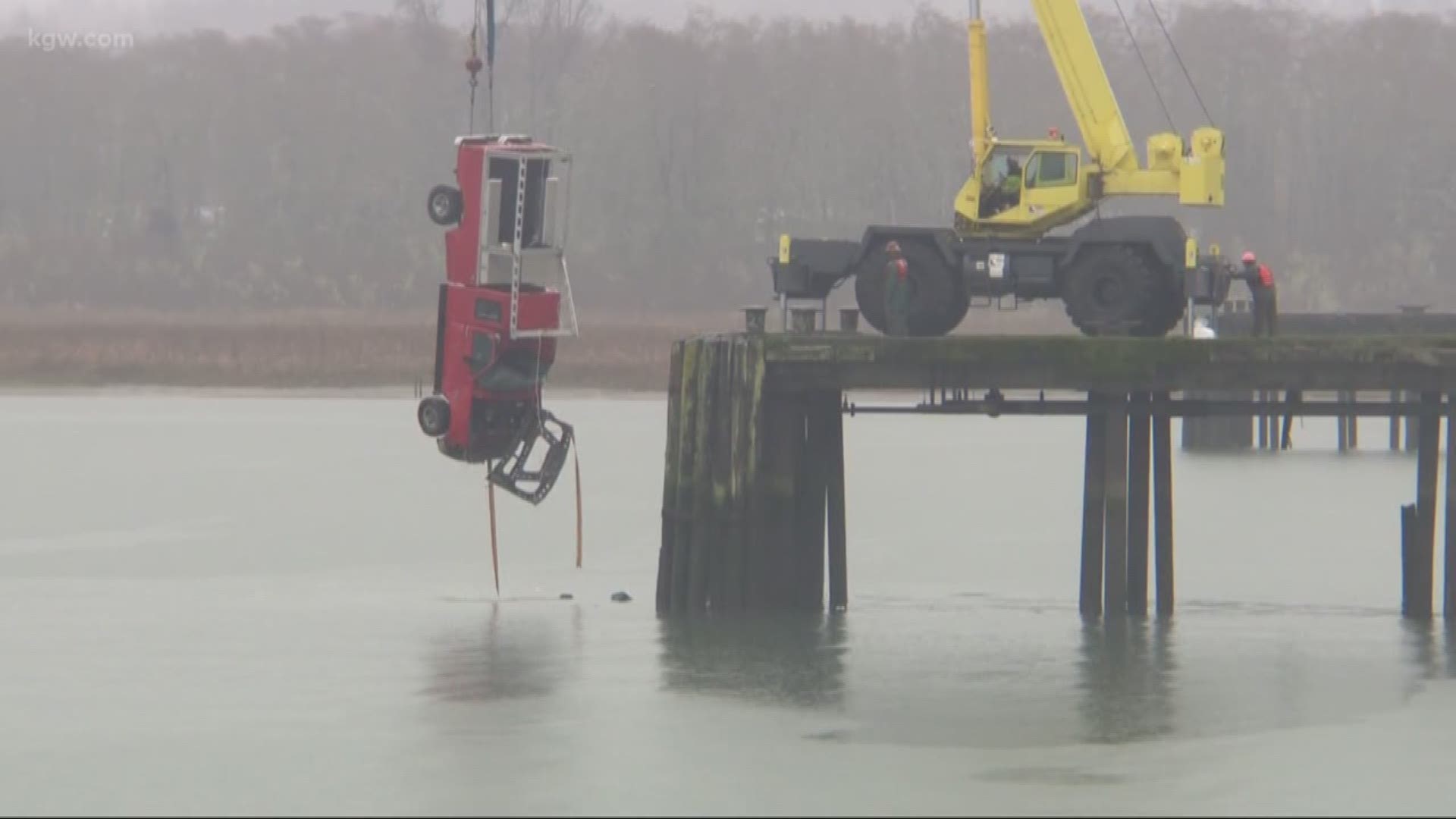 A man running from police drove off a pier in Astoria, plunging into frigid water.