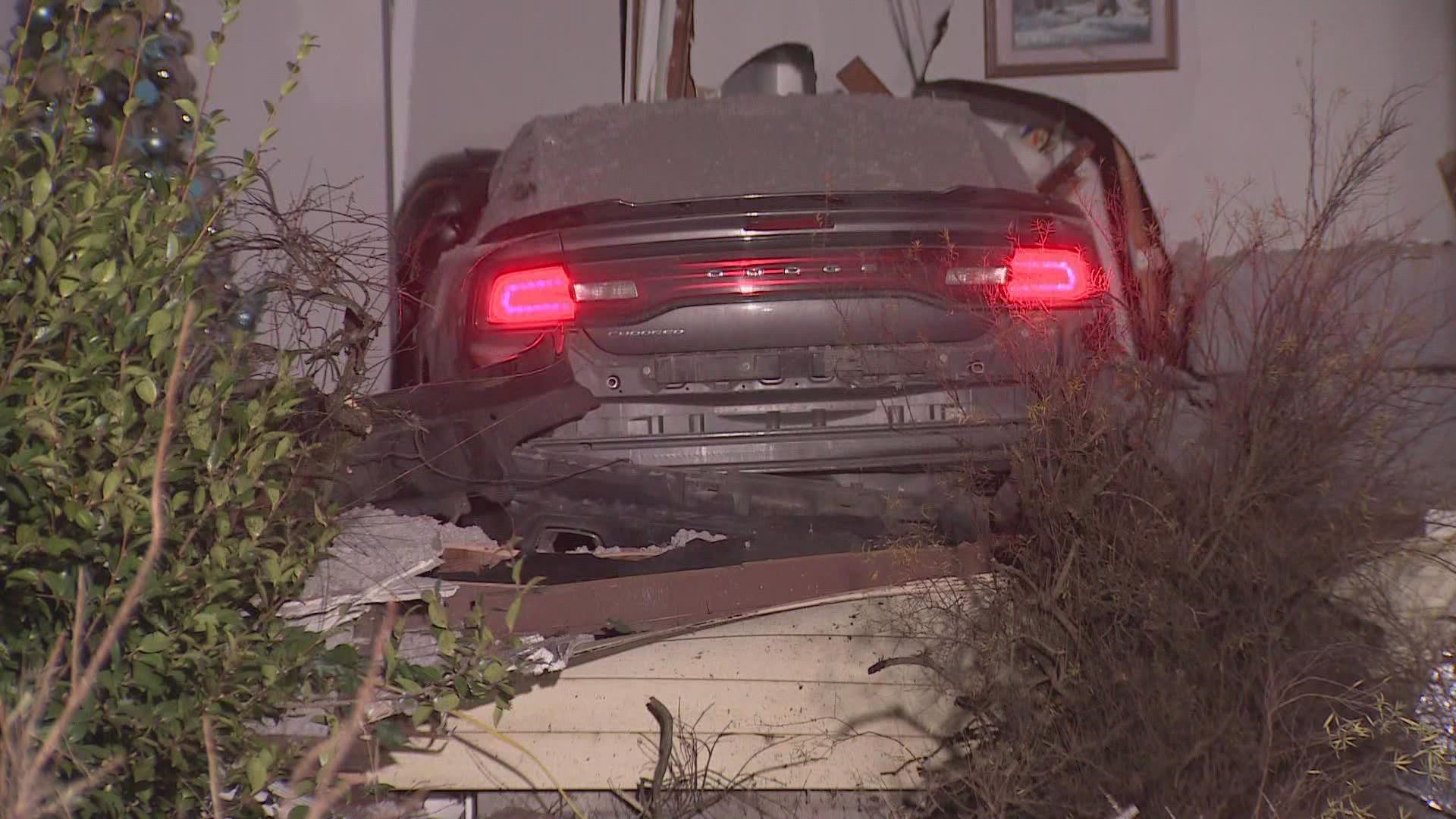 The owners of the home were sleeping when the car crashed into their living room early Wednesday morning.