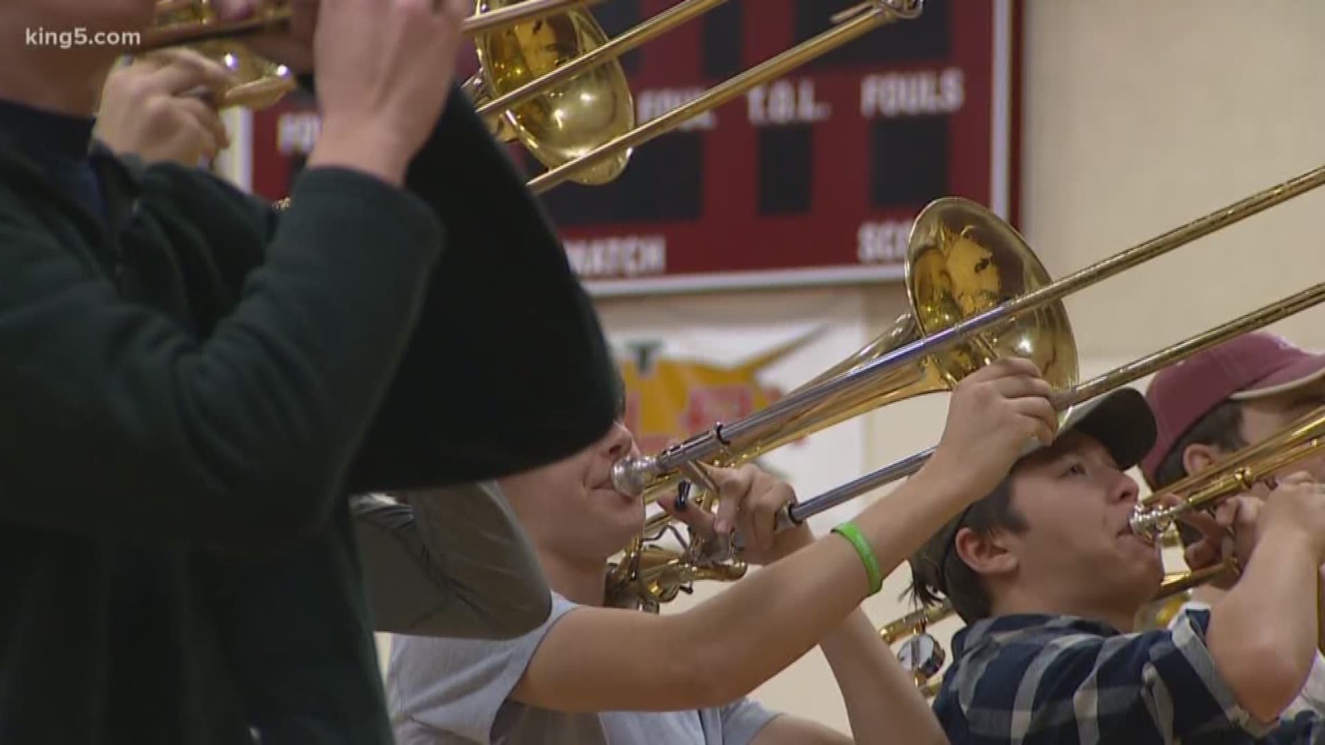 Students in the Mercer Island High School band fundraised thousands of dollars to help a band in Puerto Rico that was devastated by a hurricane get to the Rose Parade in January.