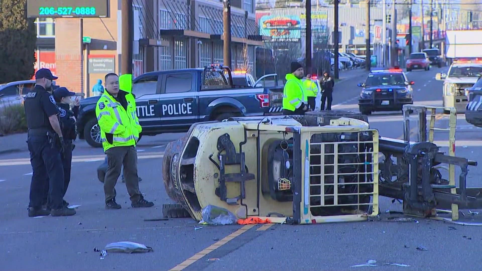 The woman was the passenger in an SUV that was struck by a forklift on Aurora Ave. in Seattle Tuesday. The forklift operator is believed to have been impaired.