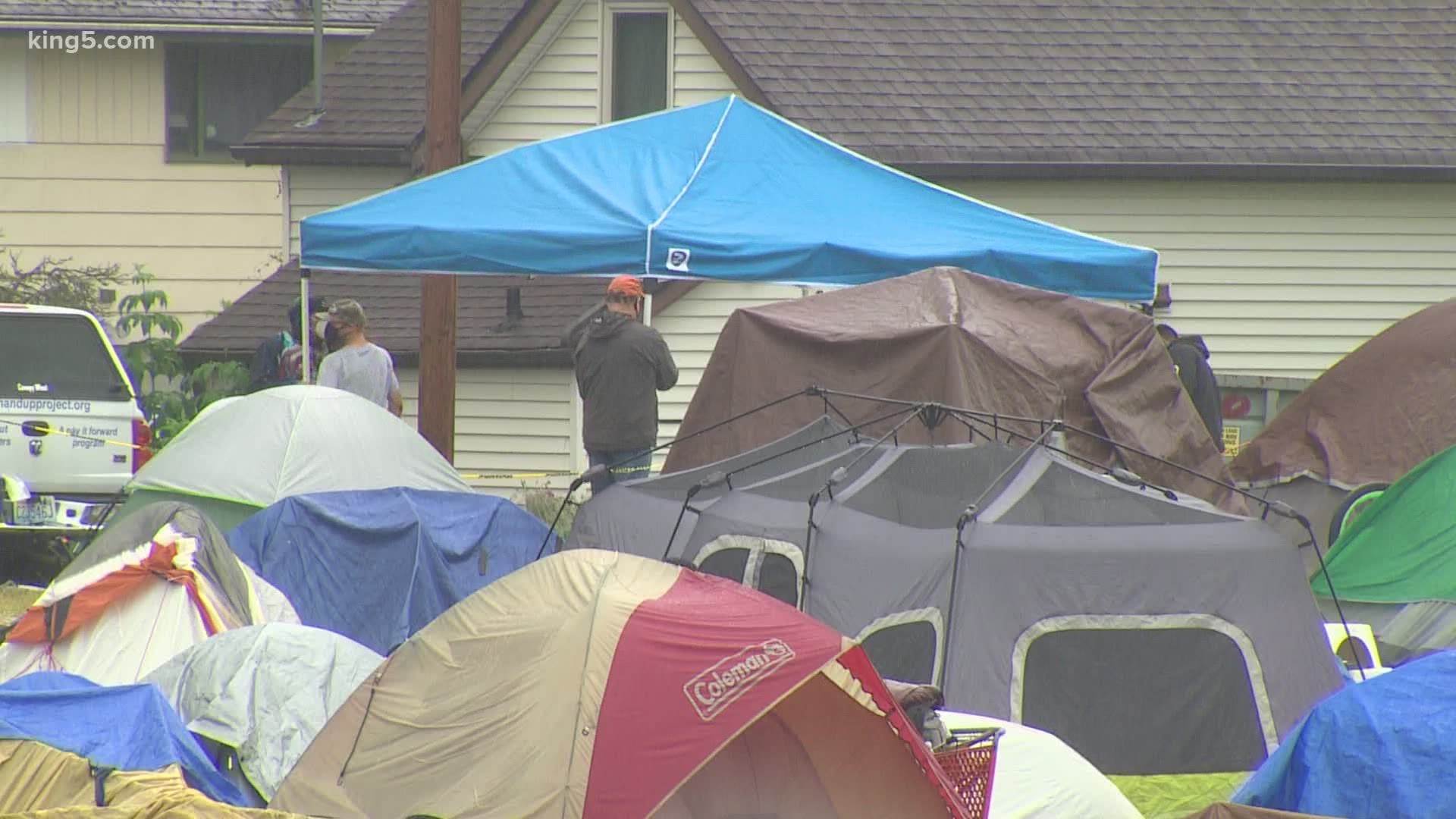 The property owner says he's allowing people to camp on the site, while non-profits help connect people with resources to get them off the streets.