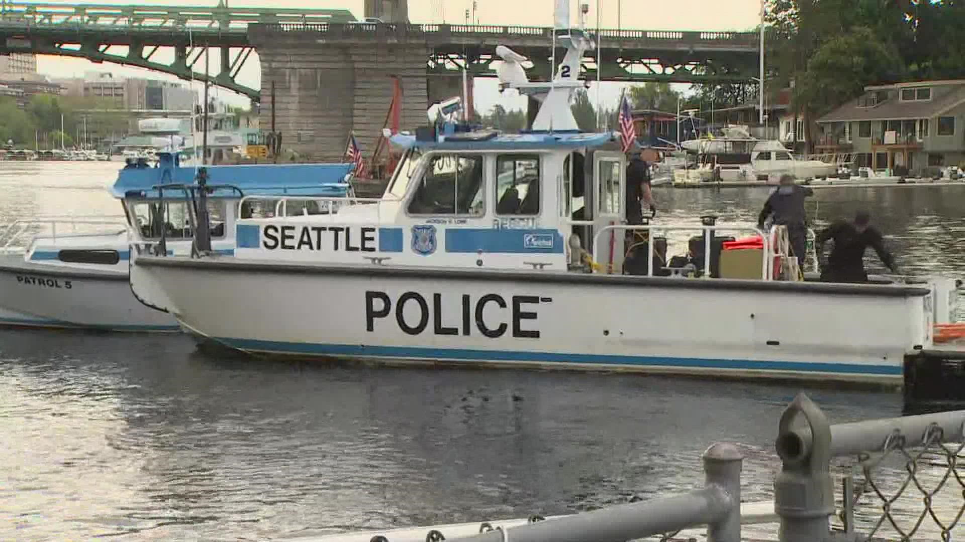Seattle police said a dive team located the missing driver's body in the water, four hours after the two-car rollover accident.
