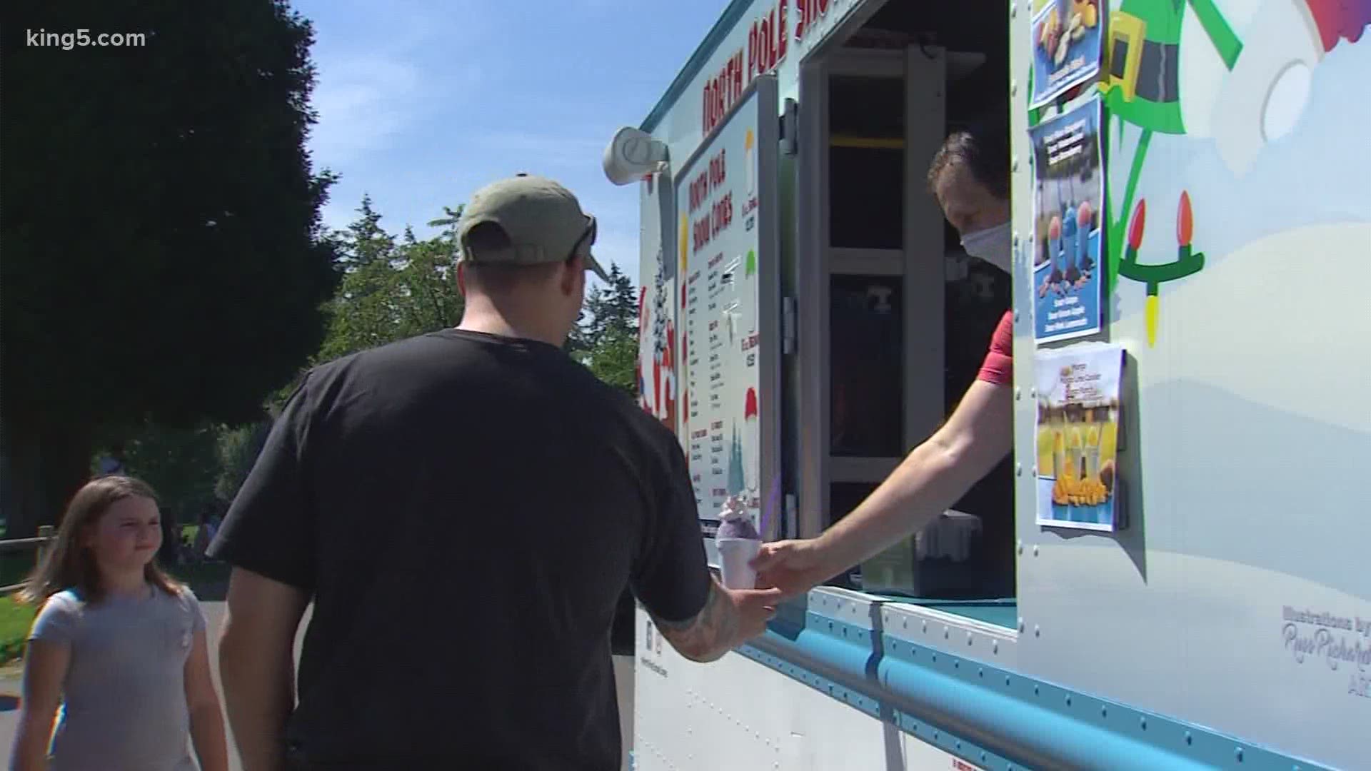 Two friends were out at a Puyallup park selling snow cones as temperatures reached triple digits.