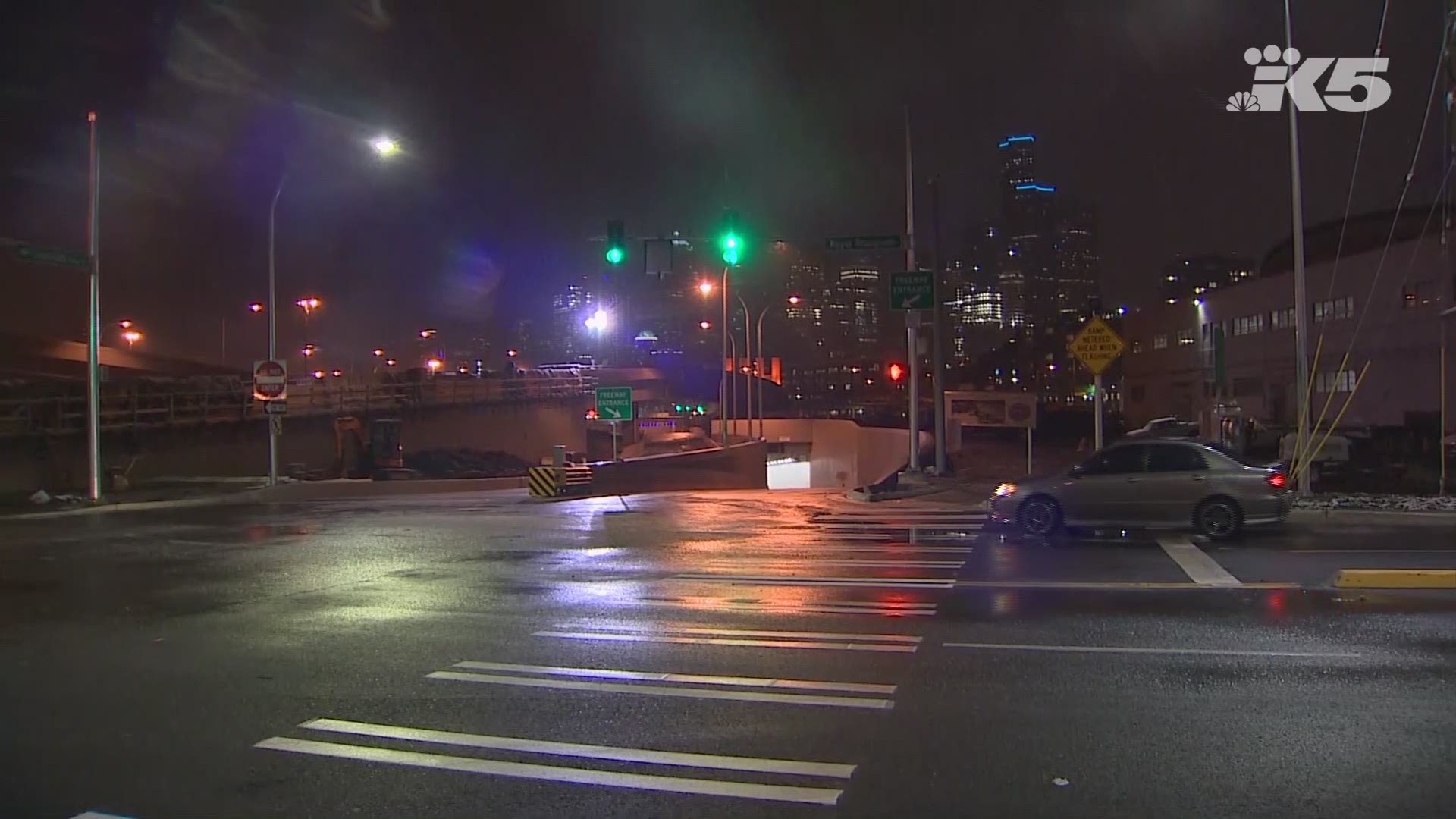 The first cars to travel through the Seattle tunnel drive on SR 99 at the north and south portals.