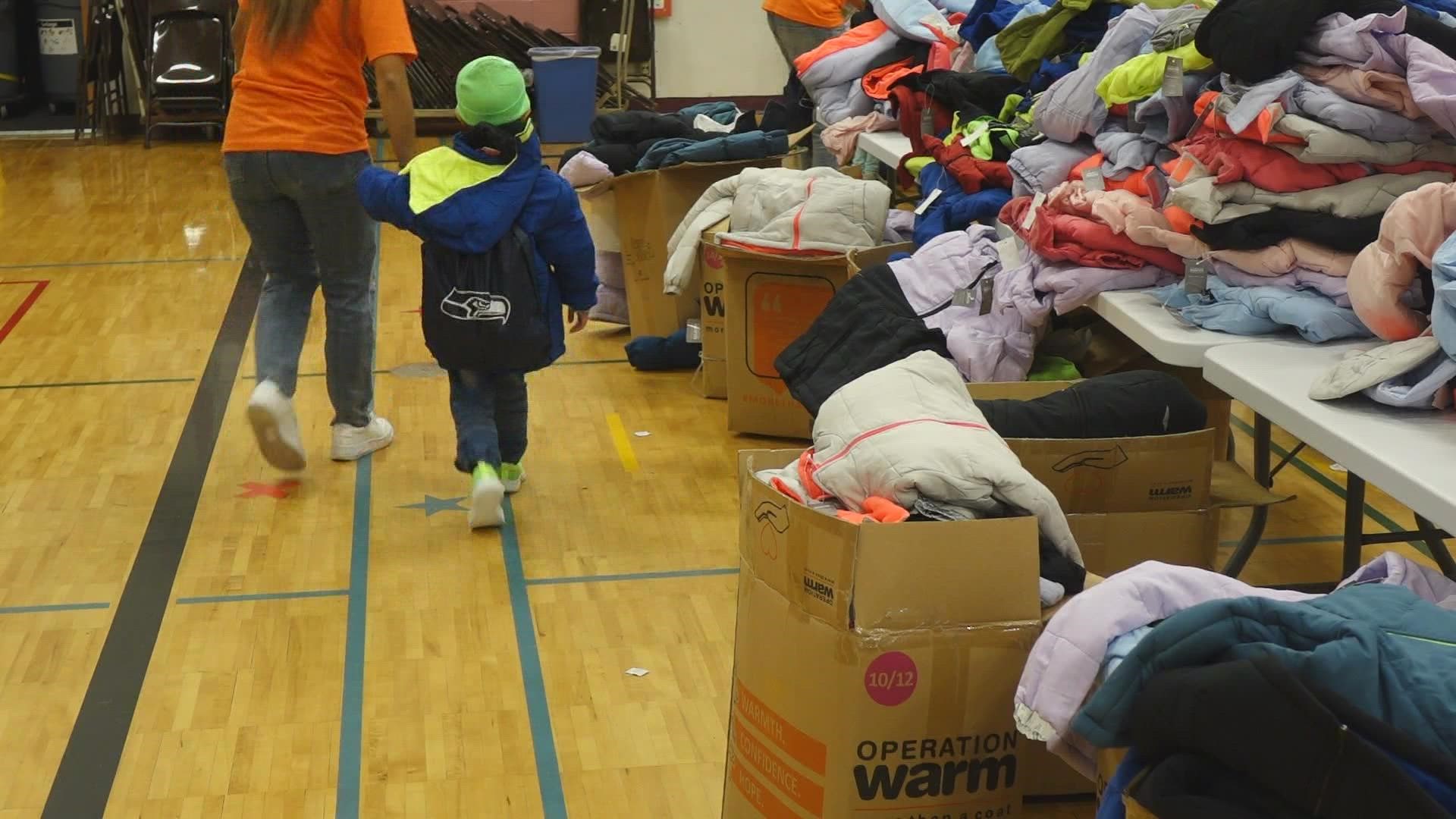 Elementary students receive free winter coats from the Seattle Seahawks