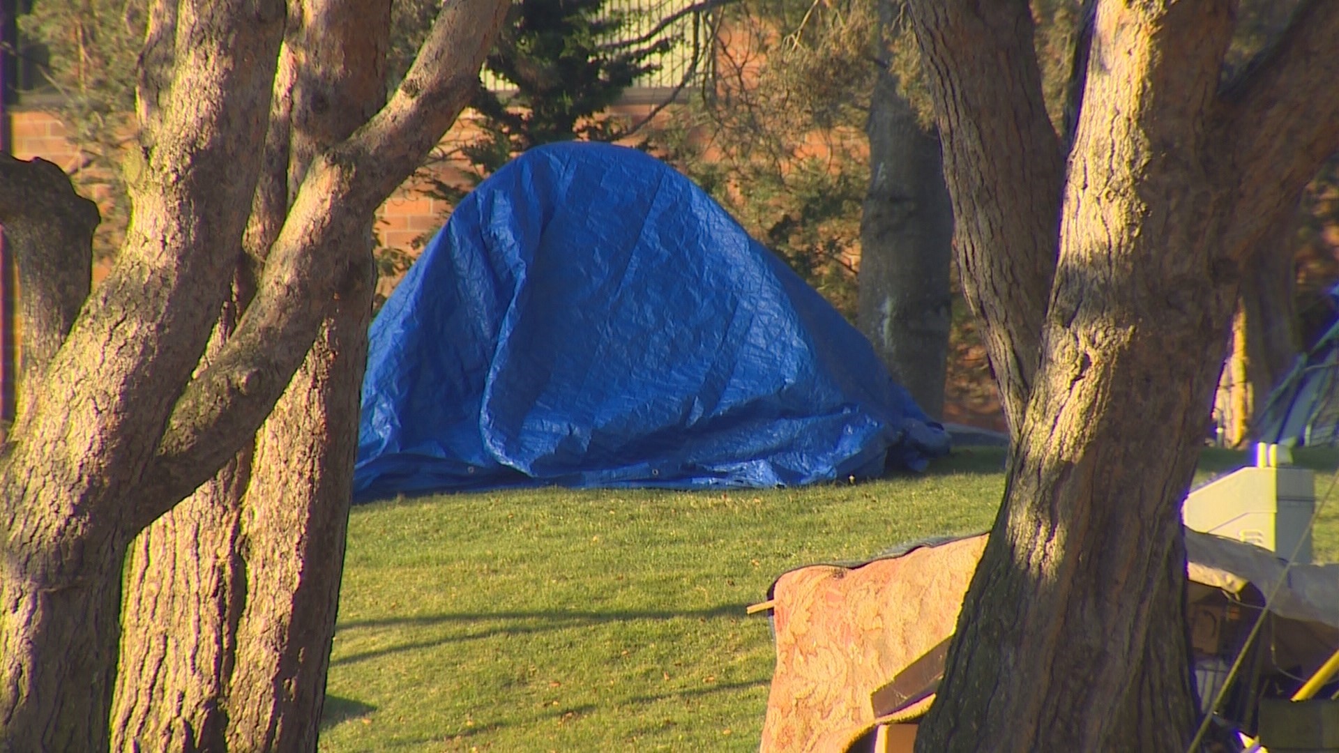 The ban, approved back in October, was meant to improve the safety of Tacoma parks.  It is now delayed until the city can establish an adequate shelter.