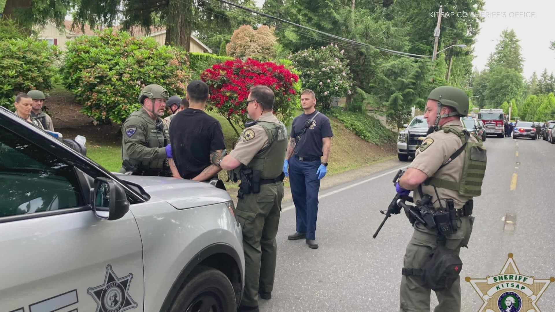 Deputies found a deceased man in a residence and a second man barricaded and armed with a rifle, according to the Kitsap County Sheriff's Office.