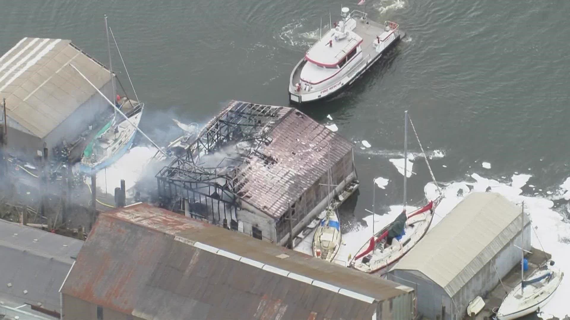 A boathouse and three boats caught fire along the Duwamish River Tuesday.