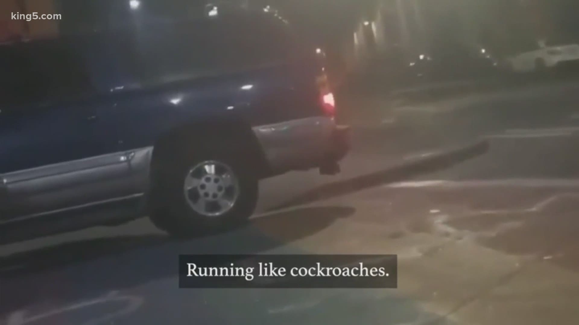 In a video shared on social media, a man who says he's with the Seattle Police appears to drive toward protesters on a sidewalk, then compares them to  "cockroaches.