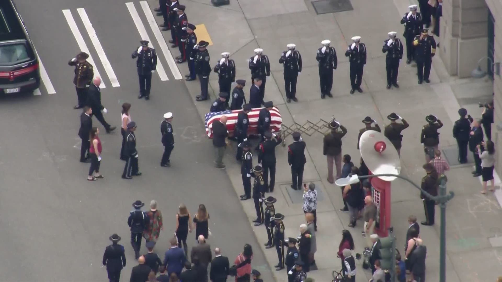 The procession transported Harris' casket to T-Mobile Park for a public memorial service.