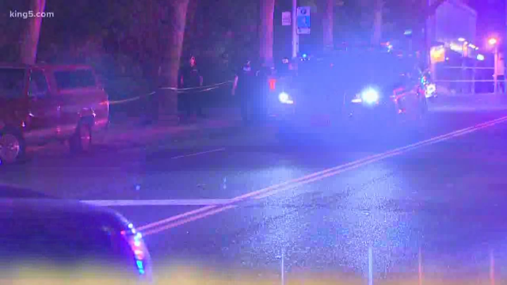 One man is in custody and another man has life threatening injuries after being shot in a large disturbance near the Seattle Center early Sunday.