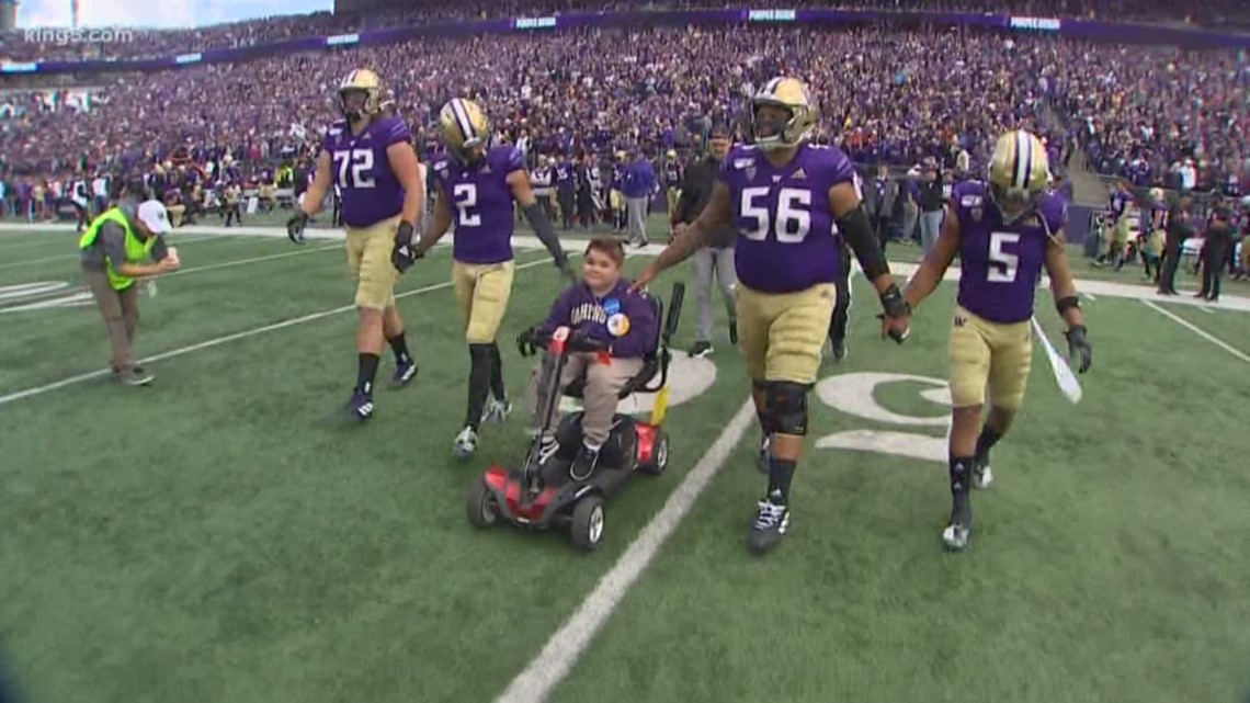Boy with genetic disorder named honorary co-captain at Huskies football game
