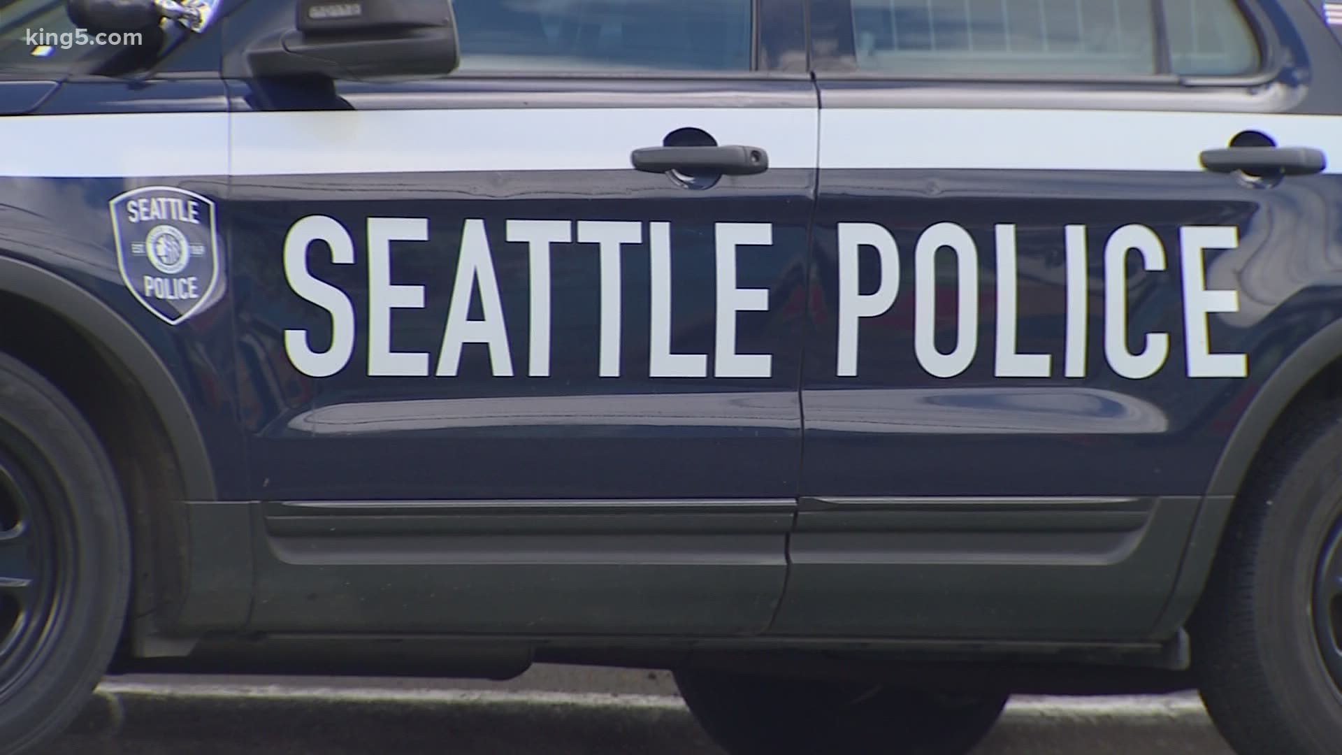 The Seattle Police Department is shifting 100 officers from specialty units to the emergency division to improve 911 response times.