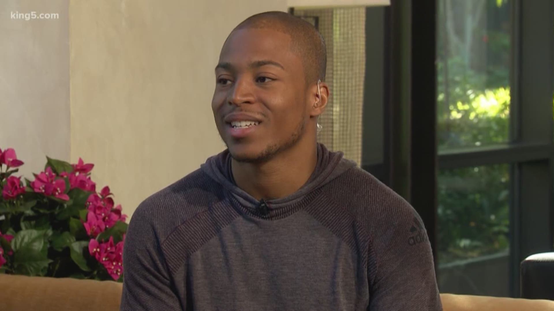 Wide receiver Tyler Lockett of the Seattle Seahawks smiles between