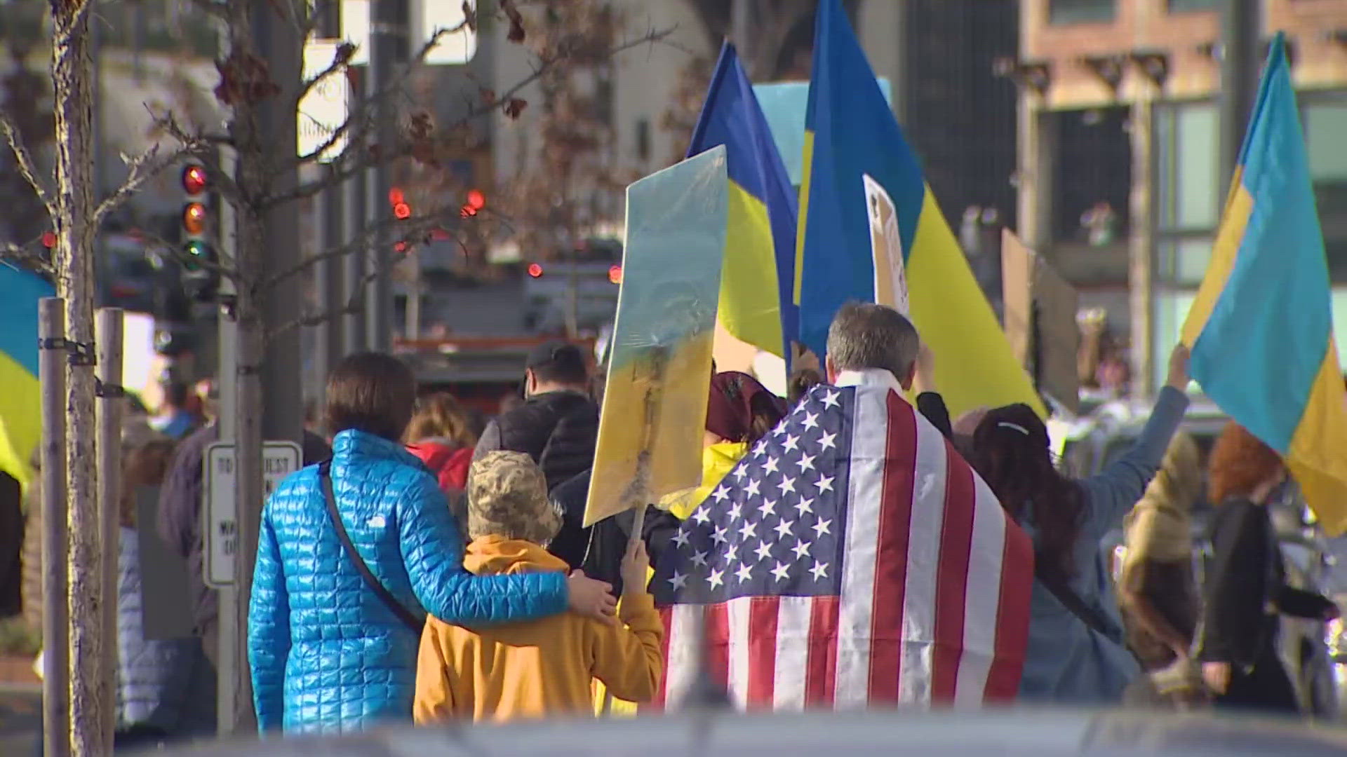 The group lined Alaskan Way before marching from the Seattle Aquarium to Colman Dock and back.
