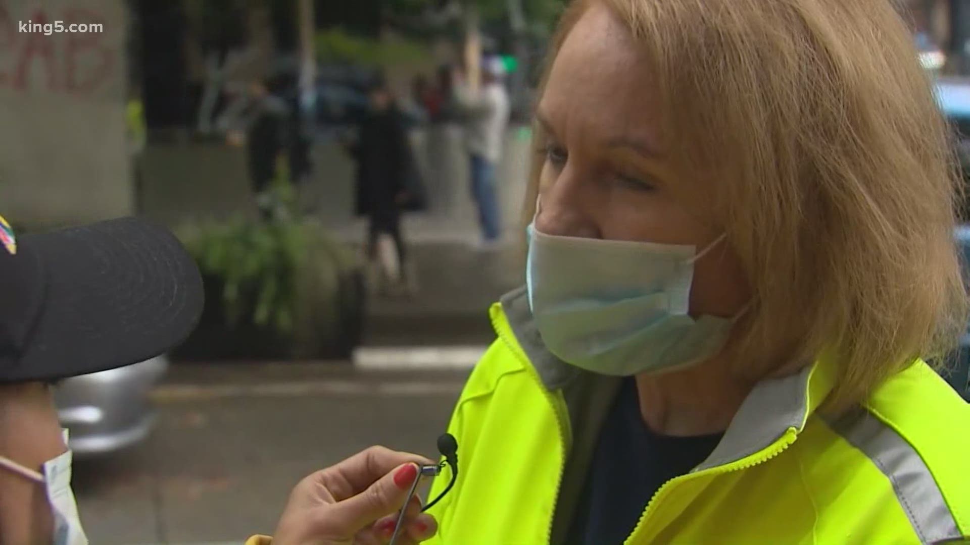 Seattle Mayor Jenny Durkan speaking with a reporter 