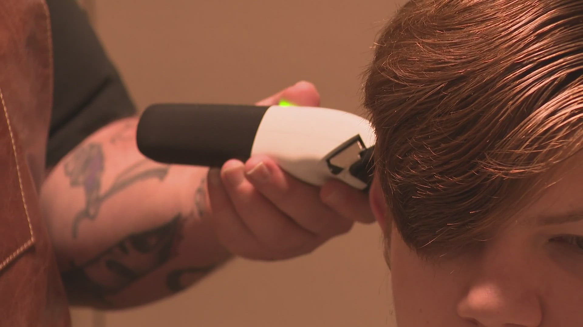 Nik Mercer opened The Barber Society in May, creating what he calls a "low sensory room".