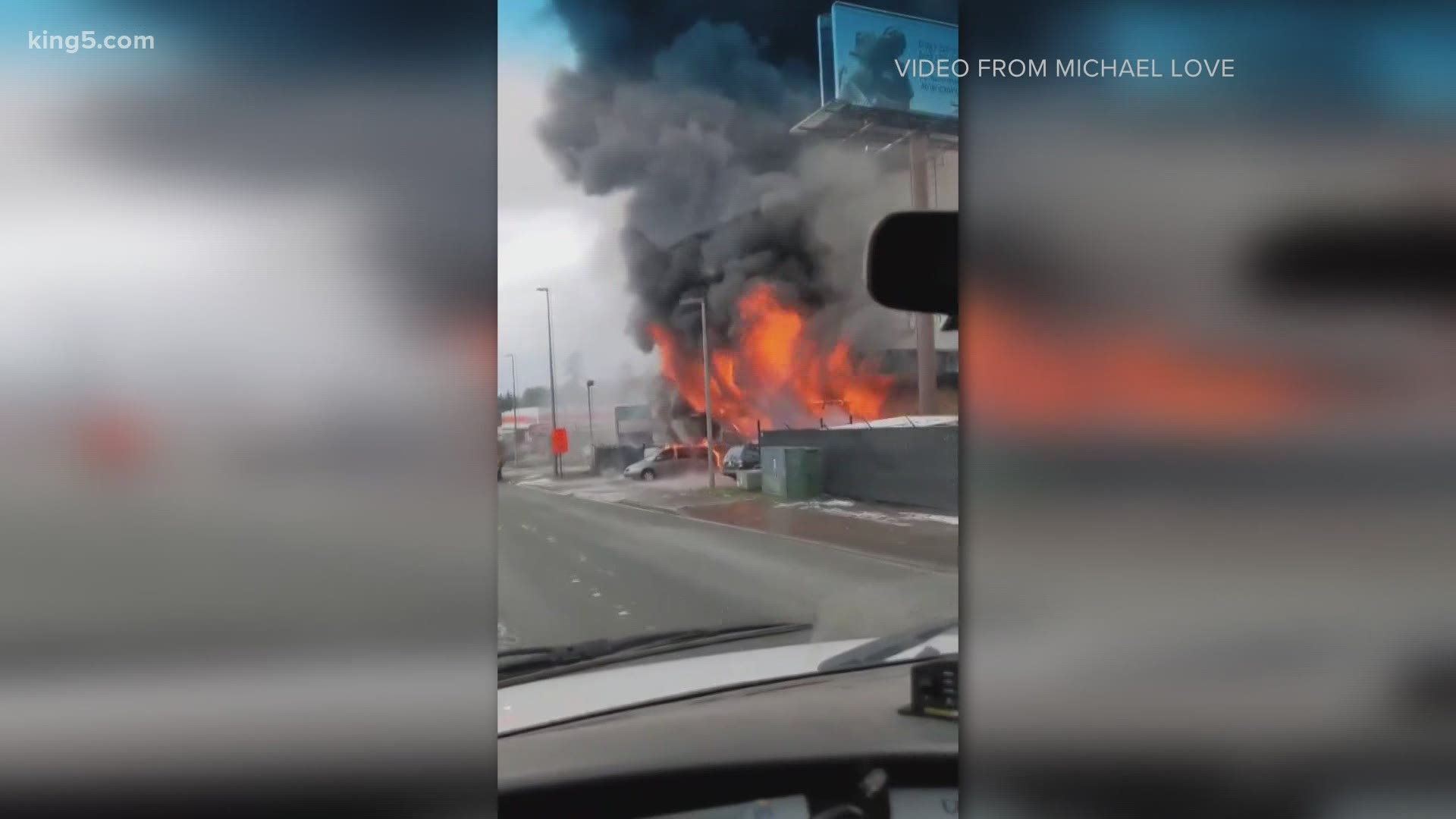 Footage from KING 5 viewer Michael Love shows flames from a commercial fire in SeaTac on Feb. 16, 2021.