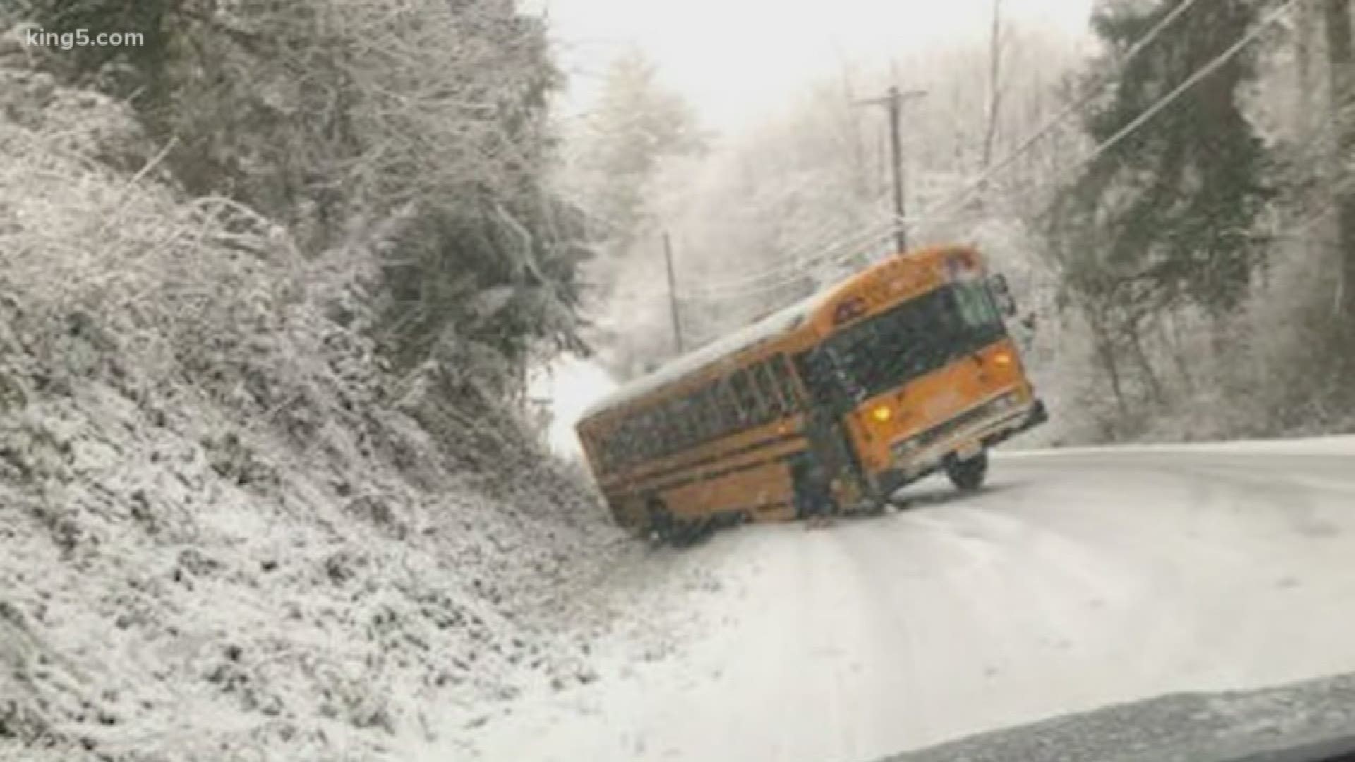 Several school districts faced a tough call this morning, whether to delay classes because of an ill-timed snowstorm. Images show buses from Issaquah and Northshore sliding on snowy roads. KING 5's Michael Crowe has the details.