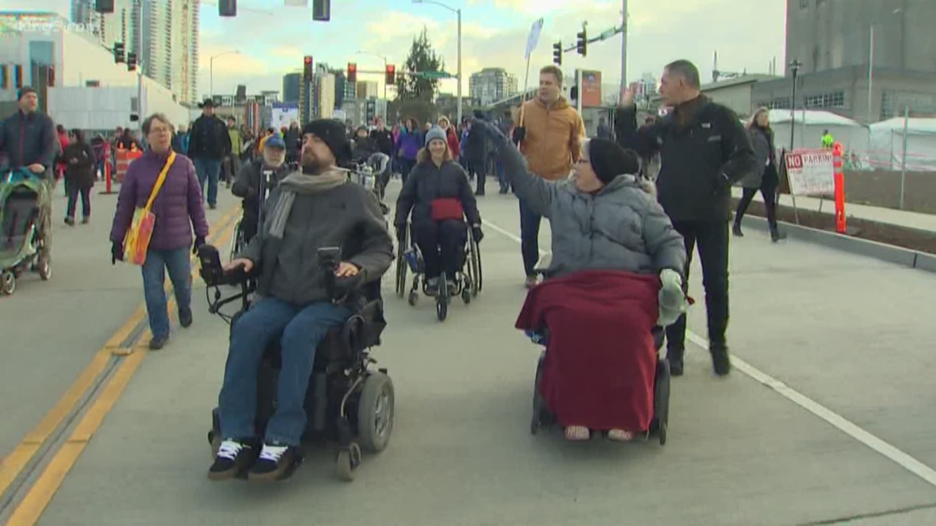 Wheelchair users and supporters rolled through tunnel to spread awareness about the challenges they face on a daily basis in Seattle.