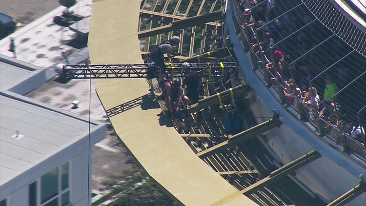 People rappel off Space Needle | king5.com