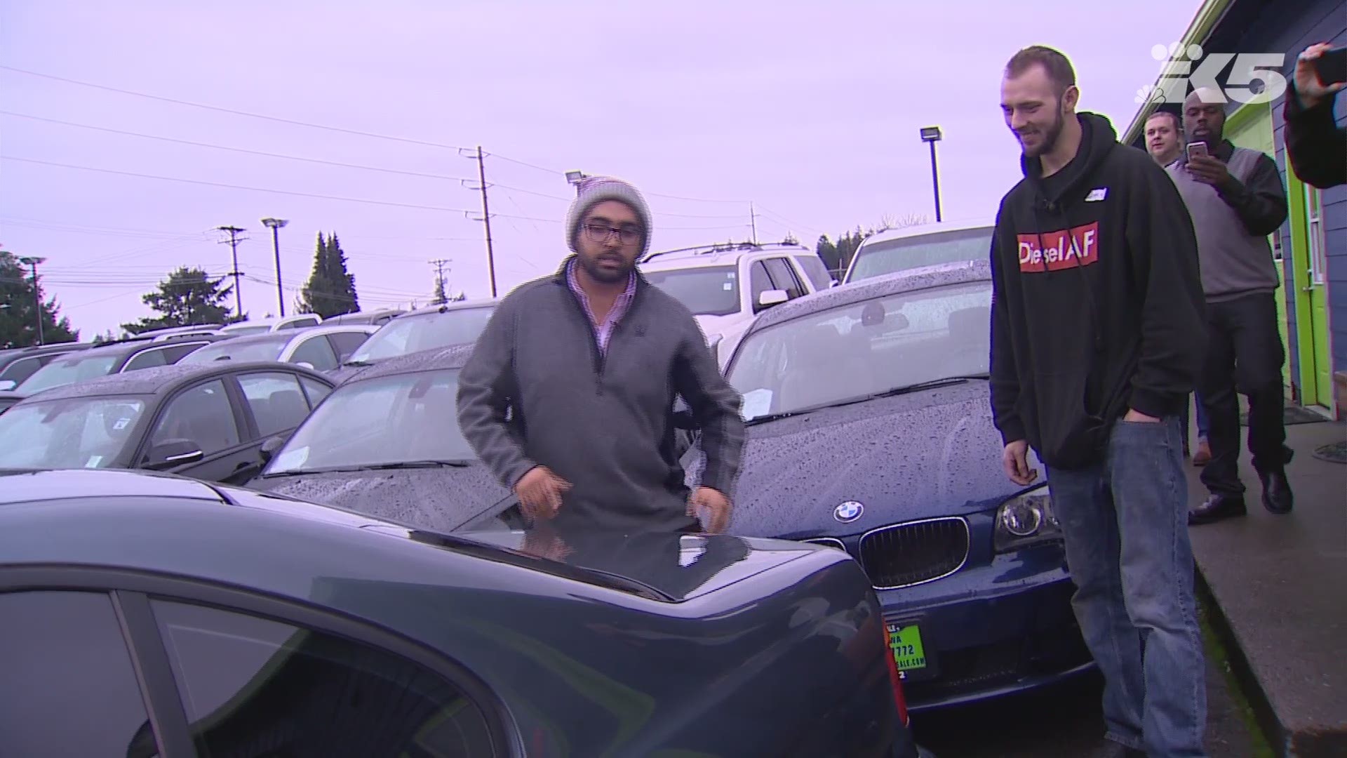 An auto dealership gave a BMW to a good Samaritan who drove his burning car out of a hospital parking garage.