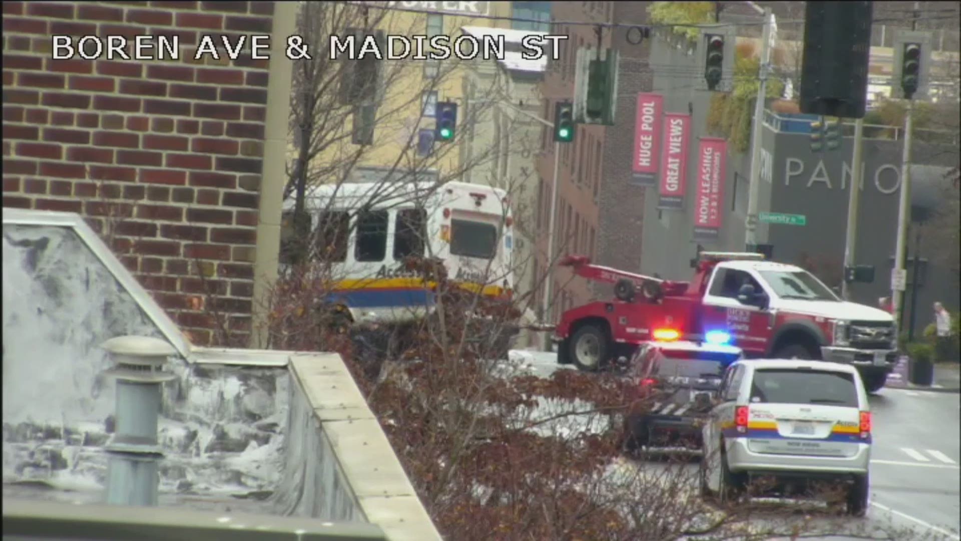 Video from a Seattle Department of Transportation camera shows a King County Metro bus being towed away after it crashed into a building.