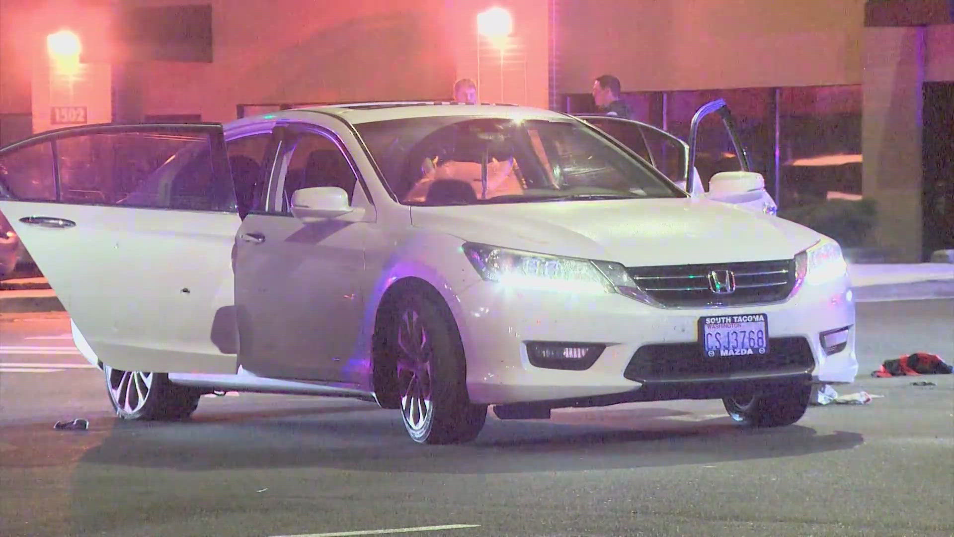 Five people were initially taken into custody, and one person was arrested related to the shooting outside a Fife Motel 6. 