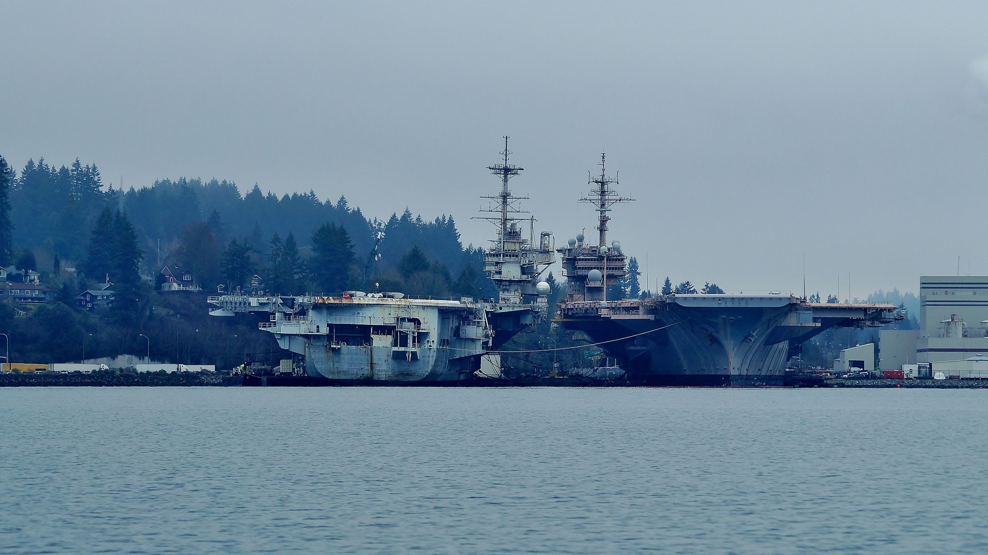 The lawsuit alleged when the Navy cleaned the hull of the decommissioned aircraft carrier, it sent bits of paint and other chemicals into Sinclair Inlet.