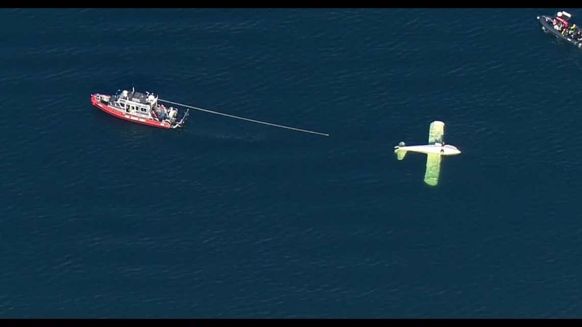Witness describes helping pilot after plane flipped into water off ...