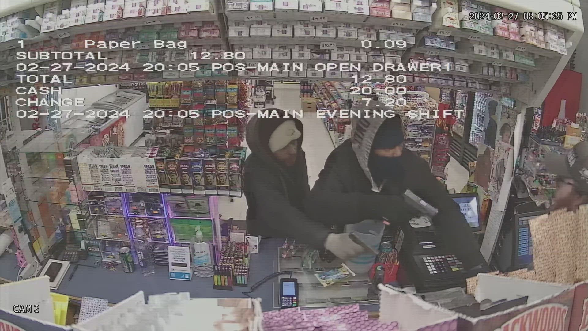 Video shows two hooded suspects pointing guns at the clerk and demanding all the cash in the register. They have not yet been caught.