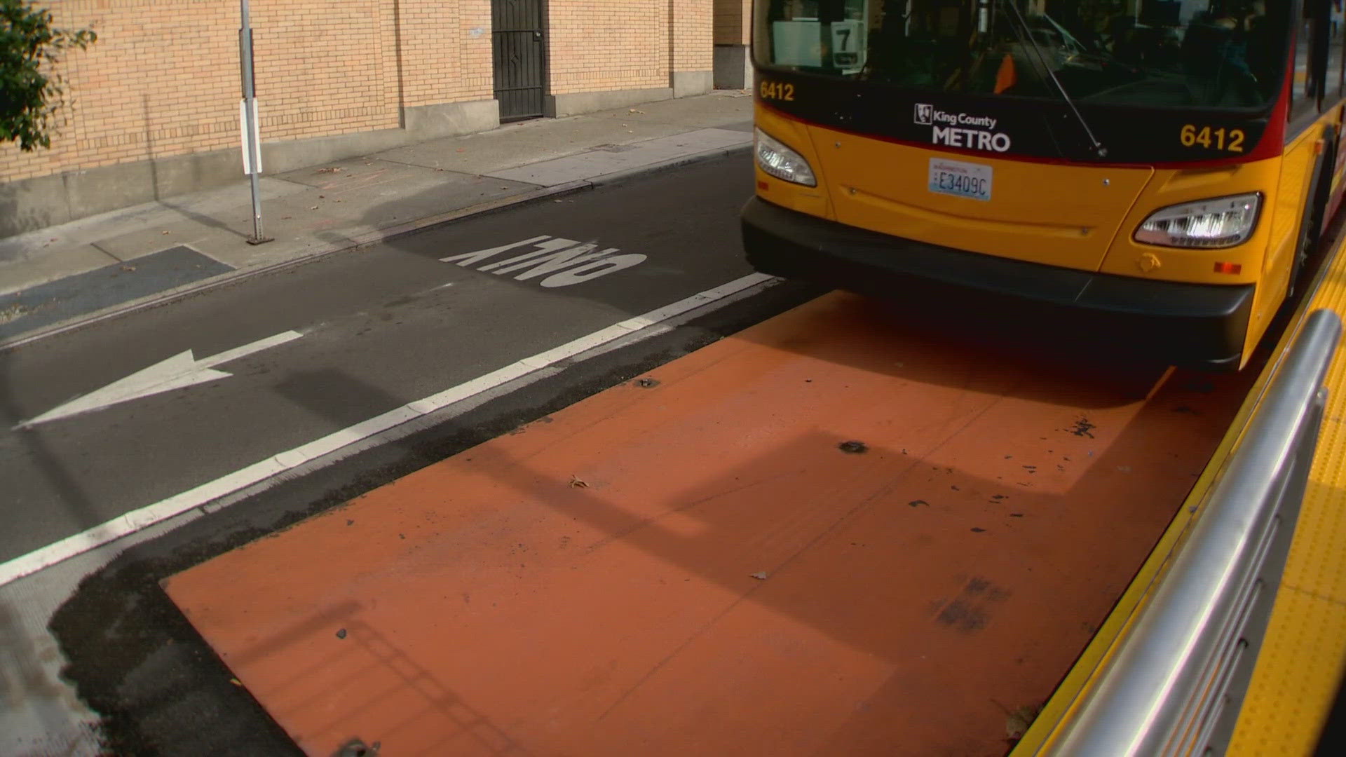 SDOT says it’s currently working on a long-term fix. Options could include hydraulic lifts on buses or pouring additional concrete to raise the street.