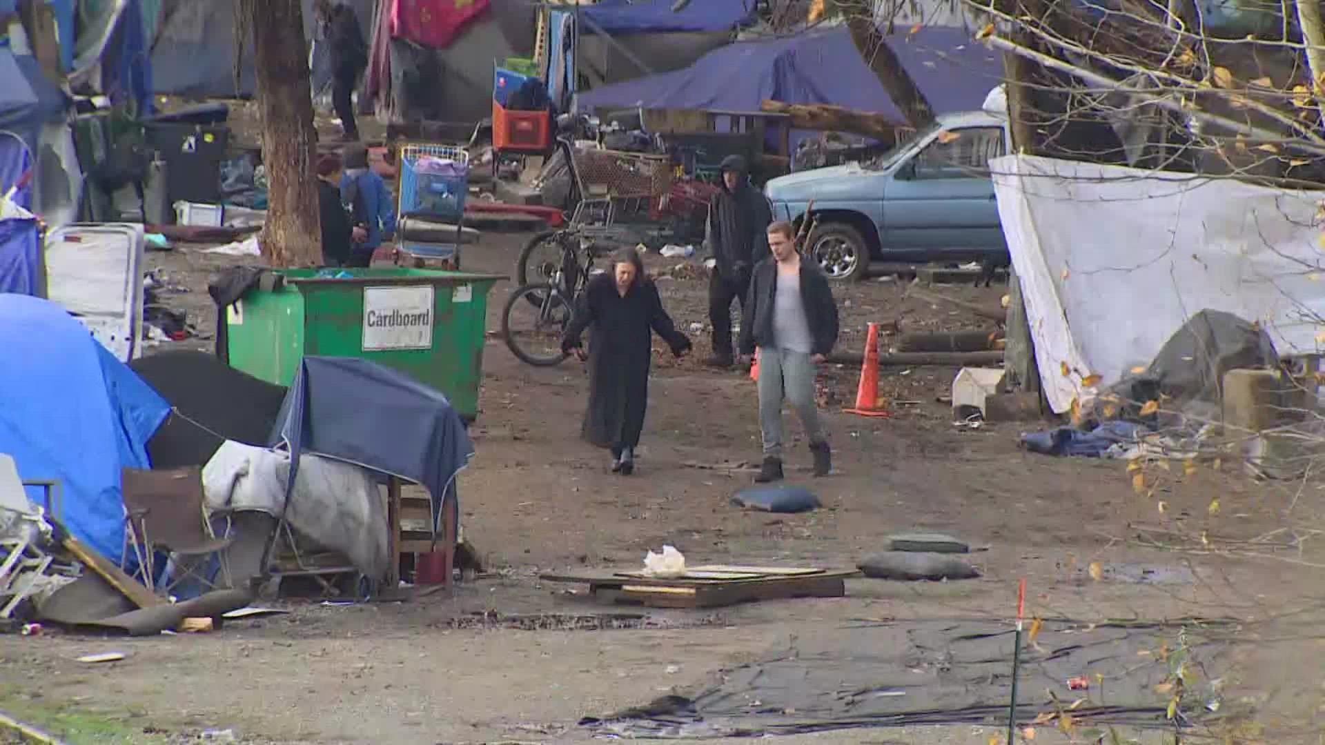 City crews in Olympia have begun clearing out a large homeless encampment on Deschutes Parkway