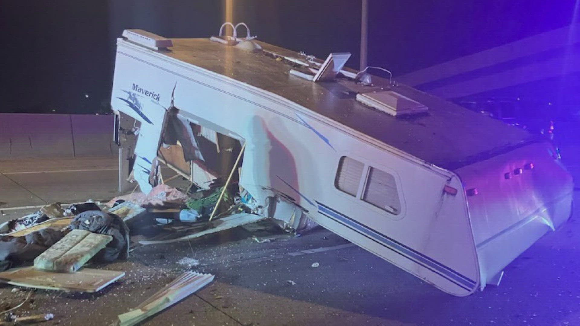 A camper trailer spread lots of debris across the center lanes of I-5 S near the Tacoma Dome early Wednesday morning