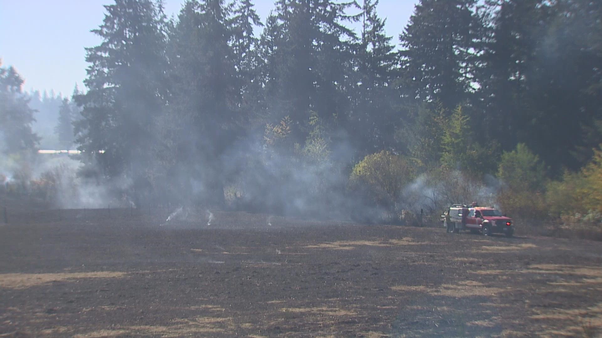 The Southeast Thurston Fire Authority says the fire engulfed more than 13 acres, and around 15 homes were evacuated.